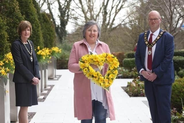 Brenda Doherty, who helped to set up the support group, was presented with a floral wreath in remembrance of all those who lost their lives during the pandemic in 2021 by the then mayoral team of Antrim and Newtownabbey Council