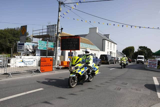 Garda motorcylists drive through Doonbeg village, Co Clare, ahead of a visit by US President Donald Trump tomorrow to the Irish Open at the nearby Trump International Golf Links & Hotel (Damien Eagers/PA Wire)