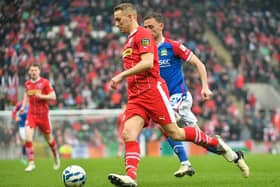 Cliftonville defender Jonny Addis has signed a new deal at Solitude
