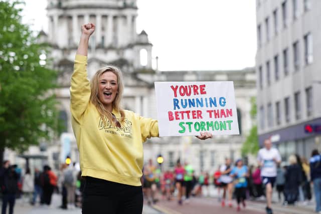 A well wisher as the Belfast City Marathon 2024 passes through the city centre