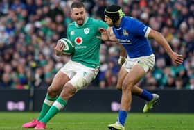 Ireland's Stuart McCloskey (left) is tackled by Italy's Ignacio Brex Juan during the Guinness Six Nations match at the Aviva Stadium in Dublin. (Photo by Brian Lawless/PA Wire)