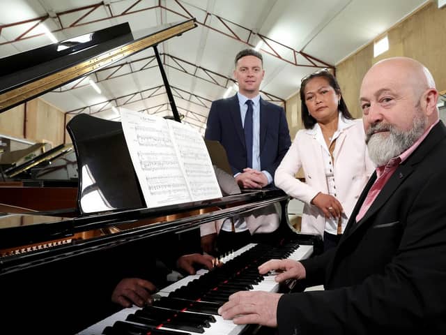 Belfast Pianos doubles capacity with Ulster Bank support. Pictured are Ulster Bank business development manager Lee White with business owners Steven and Jeena