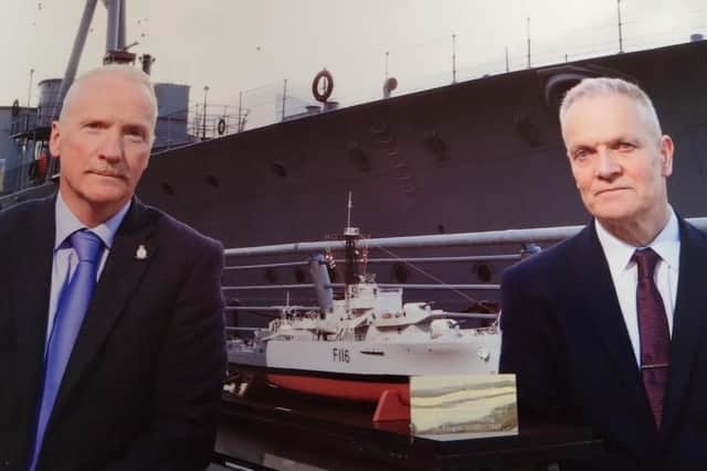 Andy Bannister and Raymond McCullough Junior with a model of HMS Amethyst