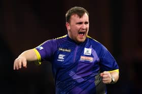 Luke Littler reacts during his win over Northern Ireland's Brendan Dolan (right) to reach the Paddy Power World Darts Championship semi-finals at Alexandra Palace. (Photo by Zac Goodwin/PA Wire)