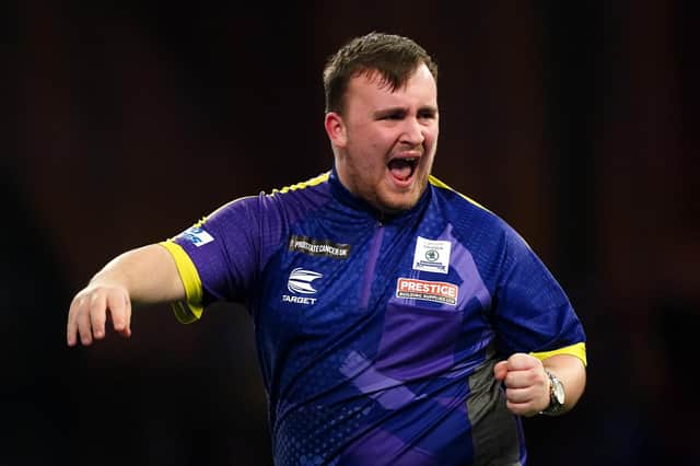 Luke Littler reacts during his win over Northern Ireland's Brendan Dolan (right) to reach the Paddy Power World Darts Championship semi-finals at Alexandra Palace. (Photo by Zac Goodwin/PA Wire)