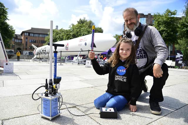 Harriet, age seven, from Coleraine with Steve Baker of UK Space Agency. Pic: Arthur Allison/Pacemaker Press
