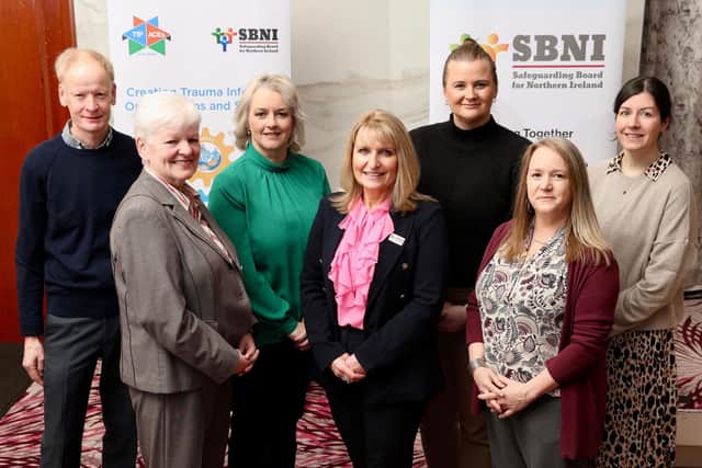 L-R: Simon Rogers, TIP Committee Chair, Bernie Mc Nally OBE, Independent Chair of Safeguarding Board for Northern Ireland (SBNI), Junior Minister Pam Cameron, Helen Mc Kenzie Operations Director, Safeguarding Board for Northern Ireland, Junior Minister Aisling Reilly, Professor Mandy Davis Director of Trauma Informed Oregon Portland State University, Jo Doherty, EPPOC Strategic Partnership Manager attend the ‘Systems to Support Our People’ conference hosted by Safeguarding Board for Northern Ireland held at Stormont Hotel today. Unresolved Adversity in Childhood and Adult Trauma in Northern Ireland Costs an Estimated £1.3 Billion Annually – Trauma Conference Hears