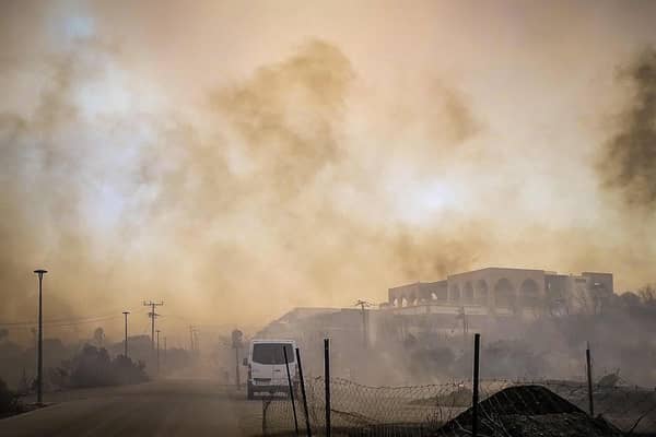 This photograph taken on July 22, 2023 shows smoke rising from a burnt hotel complex during a wildfire on the Greek island of Rhodes. Photo by EUROKINISSI/Eurokinissi/AFP via Getty Images