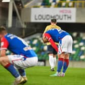 Dejected Linfield players at full time. PIC: Andrew McCarroll/ Pacemaker Press