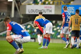 Dejected Linfield players at full time. PIC: Andrew McCarroll/ Pacemaker Press