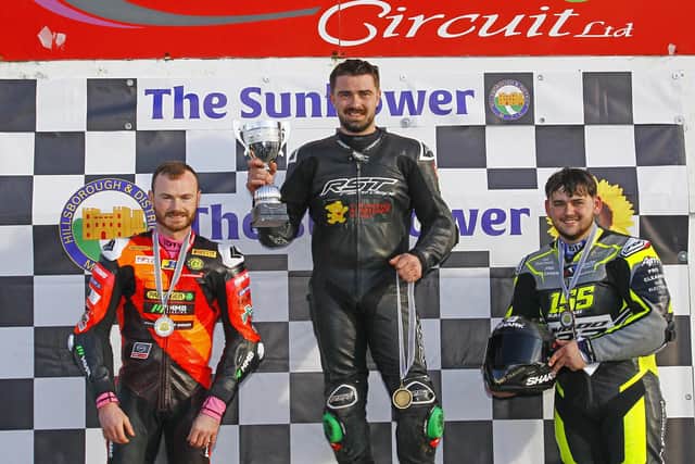 Carl Phillips won the Sunflower Trophy from Eugene McManus (left) and Jonny Campbell in 2025. (Photo by Rod Neill/Pacemaker Press)