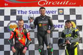 Carl Phillips won the Sunflower Trophy from Eugene McManus (left) and Jonny Campbell in 2025. (Photo by Rod Neill/Pacemaker Press)
