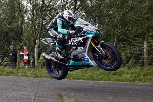 Michael Dunlop claimed pole position in Supersport qualifying on his MD Racing Yamaha at the Armoy Road Races on Friday.