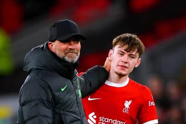 Liverpool manager Jurgen Klopp with defender and Northern Ireland international Conor Bradley - PA image