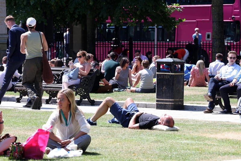 14th June 2023As the good weather continues across Northern Ireland people enjoy the sunshine at Belfast City Hall. Picture by Jonathan Porter/PressEye