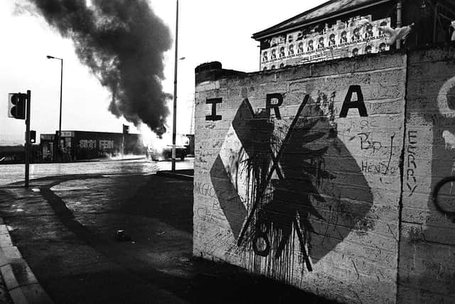 PACEMAKER BELFAST, MARCH 1988, BURNT OUT VEHICLES LITTER THE STREETS OF WEST BELFAST AFTER A NIGHT OF RIOTING