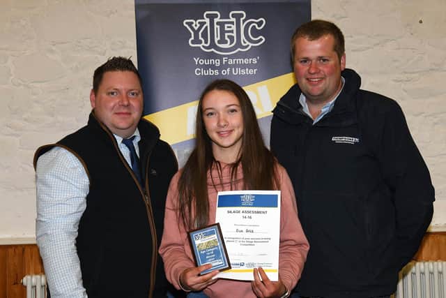 Garvagh YFC member, Eva Price who won the 14-16 age category in the silage assessment finals with YFCU president, Stuart Mills and Thompsons representative, Phillip Donaldson. Picture: YFCU
