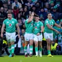 Ireland's Calvin Nash (centre) celebrates with team-mate Jack Crowley after scoring their side's sixth try of the game during the Guinness Six Nations match at the Aviva Stadium in Dublin, Ireland. PIC: Niall Carson/PA Wire.