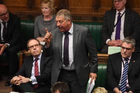 DUP MP Sammy Wilson, speaking alongside Gavin Robinson MP in the House of Commons, on a Brexit Withdrawal Agreement Bill debate in 2019, On the left is the then MP and DUP deputy leader Nigel Dodds. Credit UK Parliament/Jessica Taylor