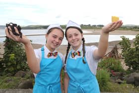 Ellie McGarry and Orla McHenry tries some dulse and yellow man from the Dessert Bar in  Ballycastle, a family business that has been procuring Dulse and making Yellow Man for generations for thousands who descend on Ballycastle for the 400-year-old Lammas Fair. PICTURE KEVIN MCAULEY/MCAULEY MULTIMEDIA