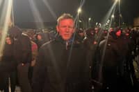 Justin McNulty published a photo of himself at 6:24am on 27 September, reporting 'a foreboding atmosphere on the Garvaghy Road with a sense of determined defiance'.