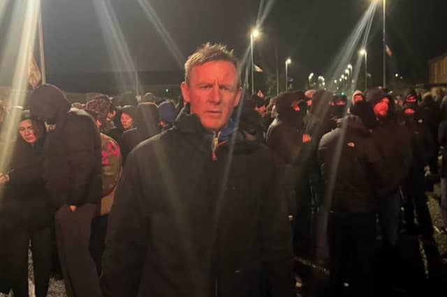Justin McNulty published a photo of himself at 6:24am on 27 September, reporting 'a foreboding atmosphere on the Garvaghy Road with a sense of determined defiance'.
