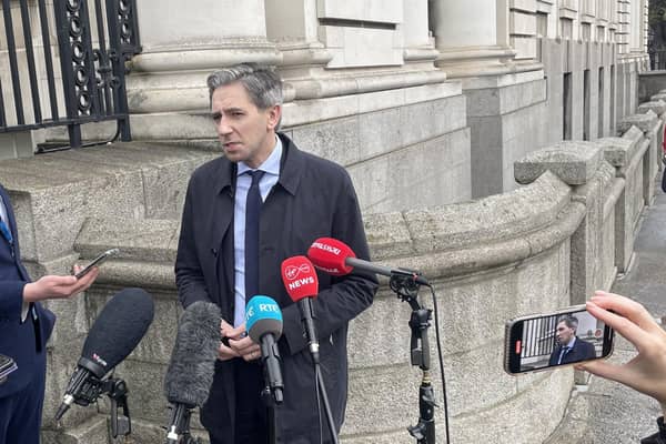 Taoiseach Simon Harris speaking to the media on his way into Cabinet in Dublin, where he said Ireland has a "legitimate expectation" that a 2020 agreement between Ireland and Britain on migration should be honoured. Photo: Grainne Ni Aodha/PA Wire