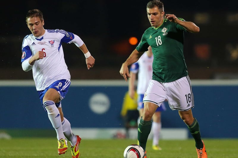 Northern Ireland's Aaron Hughes with Faroe Island's Hallur Hansson at Windsor Park. Former Newcastle United and Fulham defender Hughes, who earned 112 international caps, is currently Technical Director at the Irish Football Association