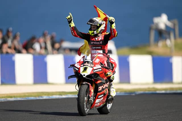 Spain's Alvaro Bautista celebrates a dominant hat-trick at Phillip Island in Australia after winning race two for a clean sweep on the Aruba.it Ducati.