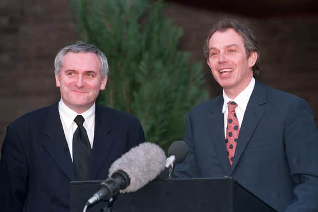Prime Minister Tony Blair and his Irish counterpart Bertie Ahern emerge from Castle Buildings to announce the signing of the Belfast Agreement in 1998