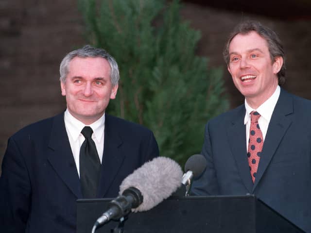 Prime Minister Tony Blair and his Irish counterpart Bertie Ahern emerge from Castle Buildings to announce the signing of the Belfast Agreement in 1998