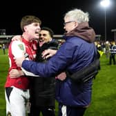 Northern Ireland-born Conor Haughey (left) celebrates with Fleetwood Town fans after his winning shoot-out penalty in a shock Carabao Cup success over Arsenal. (Photo by Nick Potts/Press Association)