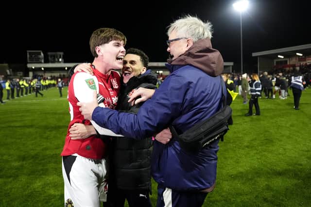 Northern Ireland-born Conor Haughey (left) celebrates with Fleetwood Town fans after his winning shoot-out penalty in a shock Carabao Cup success over Arsenal. (Photo by Nick Potts/Press Association)