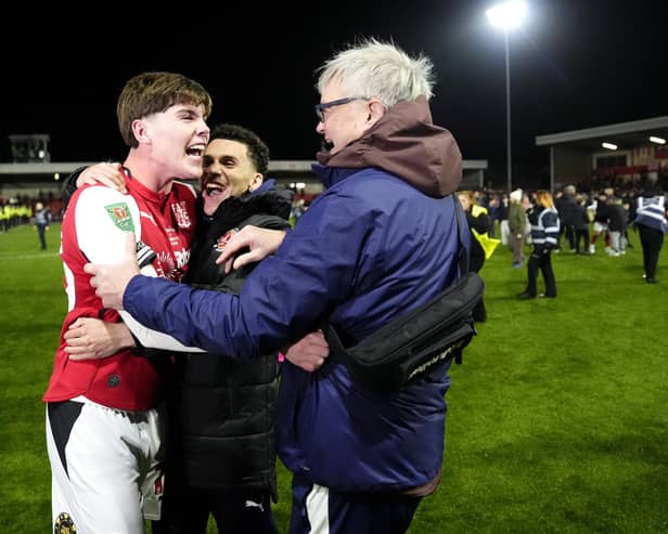 Northern Ireland-born Conor Haughey (left) celebrates with Fleetwood Town fans after his winning shoot-out penalty in a shock Carabao Cup success over Arsenal. (Photo by Nick Potts/Press Association)