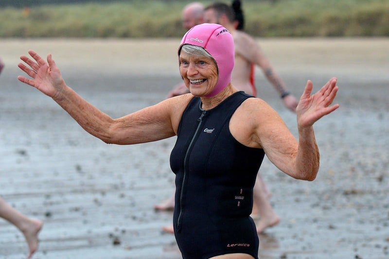 A swimmer makes her way to the sea during the annual Christmas morning charity swim