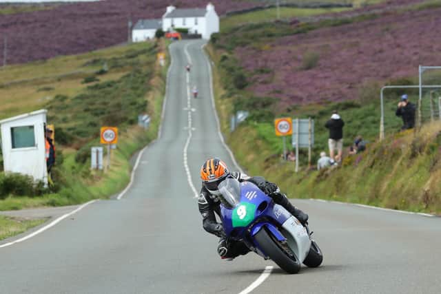James Hind is the fastest rider in the Lightweight class so far at the Manx Grand Prix after lapping at more than 116mph on Dennis Trollope's TZ250 Yamaha.