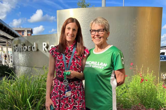 Bernie Burke (right), 61, handing her medal to surgeon Helen Raffalli-Ebezant, after completing a Macmillan Mighty Hike two months after a brain haemorrhage. 
Mrs Burke was operated on by neurosurgeon Helen Raffalli-Ebezant, after suffering the subarachnoid haemorrhage in April. She completed the 26-mile walk with son Sean, 34, and handed her medal to Ms Raffalli-Ebezant afterwards. Photo: Macmillan Cancer Support/PA Wire