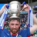 Linfield's Mark Stafford celebrates with the Gibson Cup after being crowned champions in 2019. PIC: INPHO/Brian Little