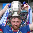 Linfield's Mark Stafford celebrates with the Gibson Cup after being crowned champions in 2019. PIC: INPHO/Brian Little