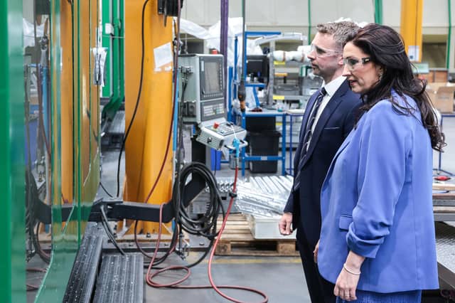 Portadown-based SAM NI has completed a £10 million expansion of its manufacturing facility marking a major milestone in the company’s continued growth. Joel Best, operations director at SAM NI shows Emma Little-Pengelly, dFM, some of the new machinery they have invested in recently
