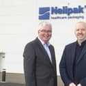 Nelipak invests £480,000 in its Derry workforce to boost productivity. Pictured is Niall Casey, director of skills and competitiveness, Invest NI and Simon Adcock, plant manager, Nelipak