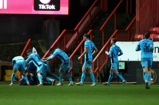 Oxford United's Oisin Smyth celebrates scoring their side's second goal of the game with teammates during the Sky Bet League One match at The Valley, London