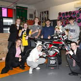 Motocross star Glenn McCormick pictured with pupils and staff at Rosstulla School in Newtownabbey. Picture: Maurice Montgomery