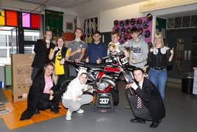 Motocross star Glenn McCormick pictured with pupils and staff at Rosstulla School in Newtownabbey. Picture: Maurice Montgomery