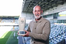 Larne's Gary Haveron collects the September NIFWA Manager of the Month trophy