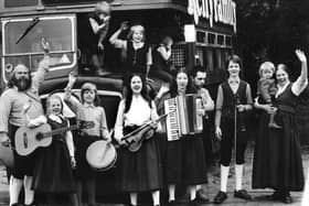 A young Kathy Kelly, front middle, holding a violin