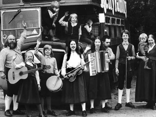 A young Kathy Kelly, front middle, holding a violin
