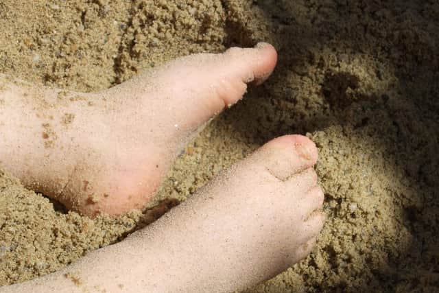 Feet in the sand.