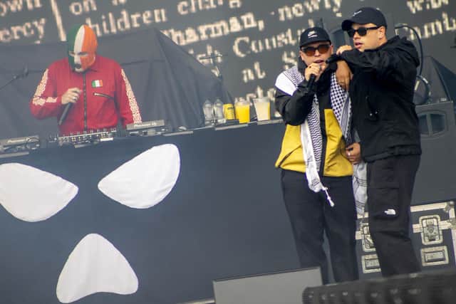 Kneecap - JJ O'Dochartaigh (DJ Provai), Liam Og O Hannaidh (Mo Chara) and Naoise O Caireallain (Moglai Bap) - perform on stage at London's Finsbury Park, as support act to headliners Fontaines DC in summer 2025. Photo: Jeff Moore/PA Wire
