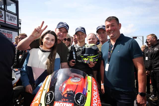 Richard Cooper celebrates his Supertwin success at the North West 200 with KMR Kawasaki boss Ryan Farquhar, family and friends